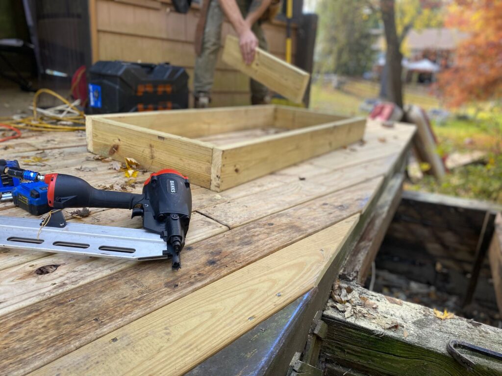 New lumber framing for a deck on a wooden platform